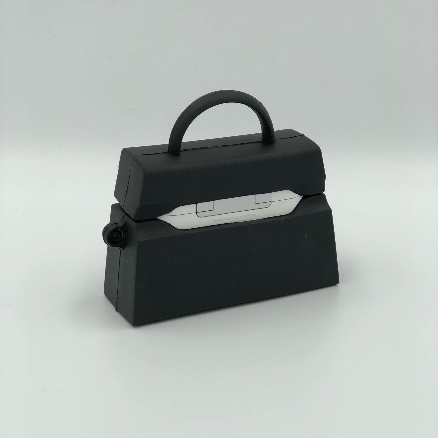 Black Silicone Handbag Airpod Case - Back view.  Apple AirPods and Apple Airpod case are for reference only and are not included