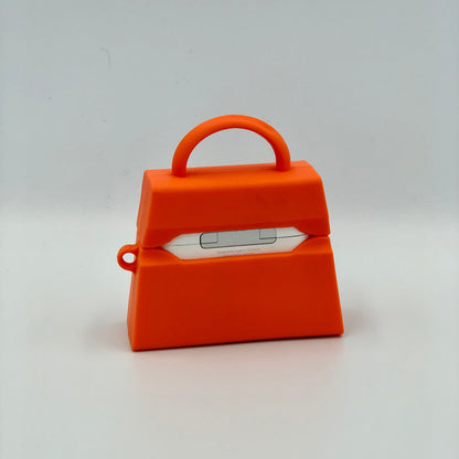 Orange Silicone Handbag Airpod Case - Back view. Apple AirPods and Apple Airpod case are for reference only and are not included.
