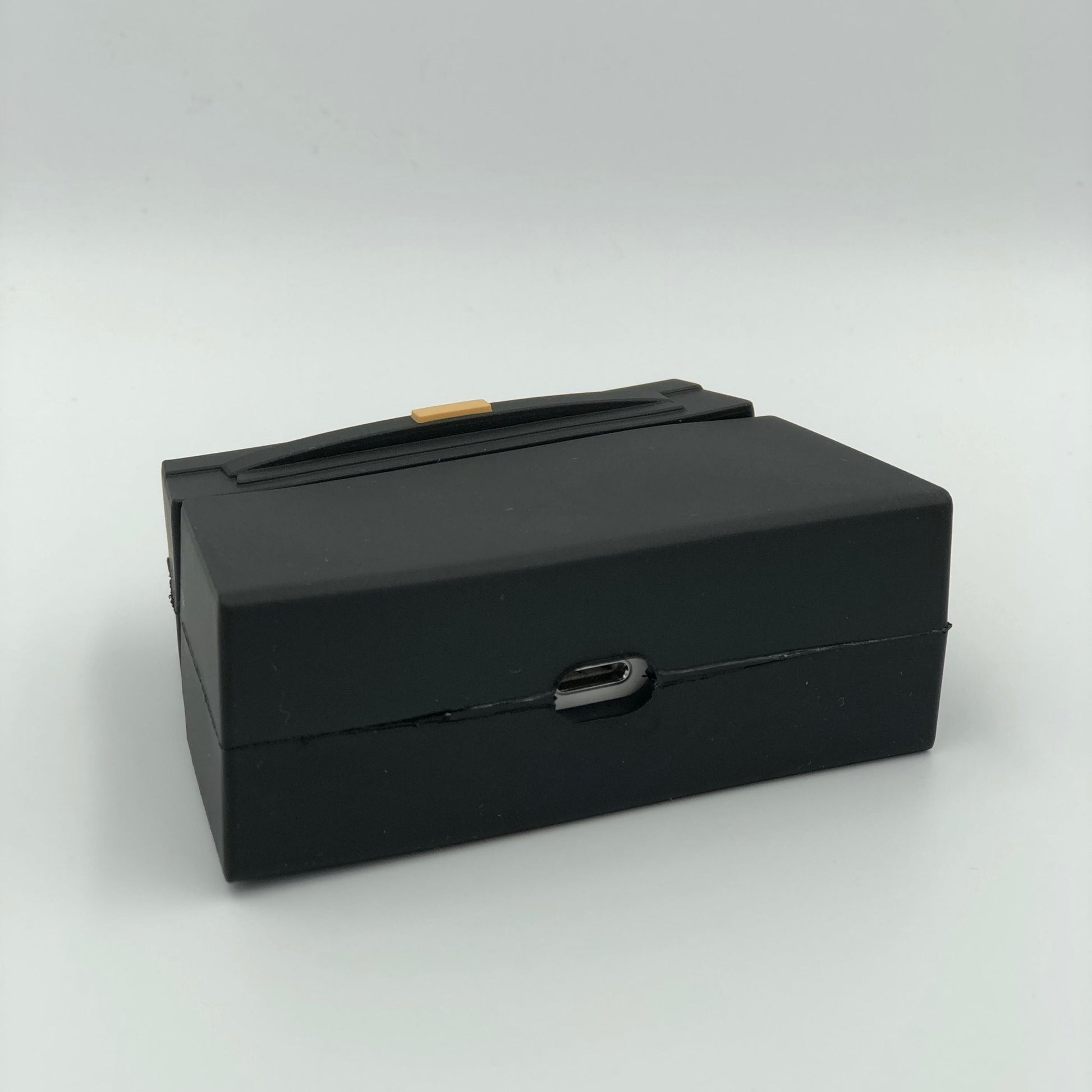 Black Silicone Handbag Airpod Case - Bottom view. Apple AirPods and Apple Airpod case are for reference only and are not included.