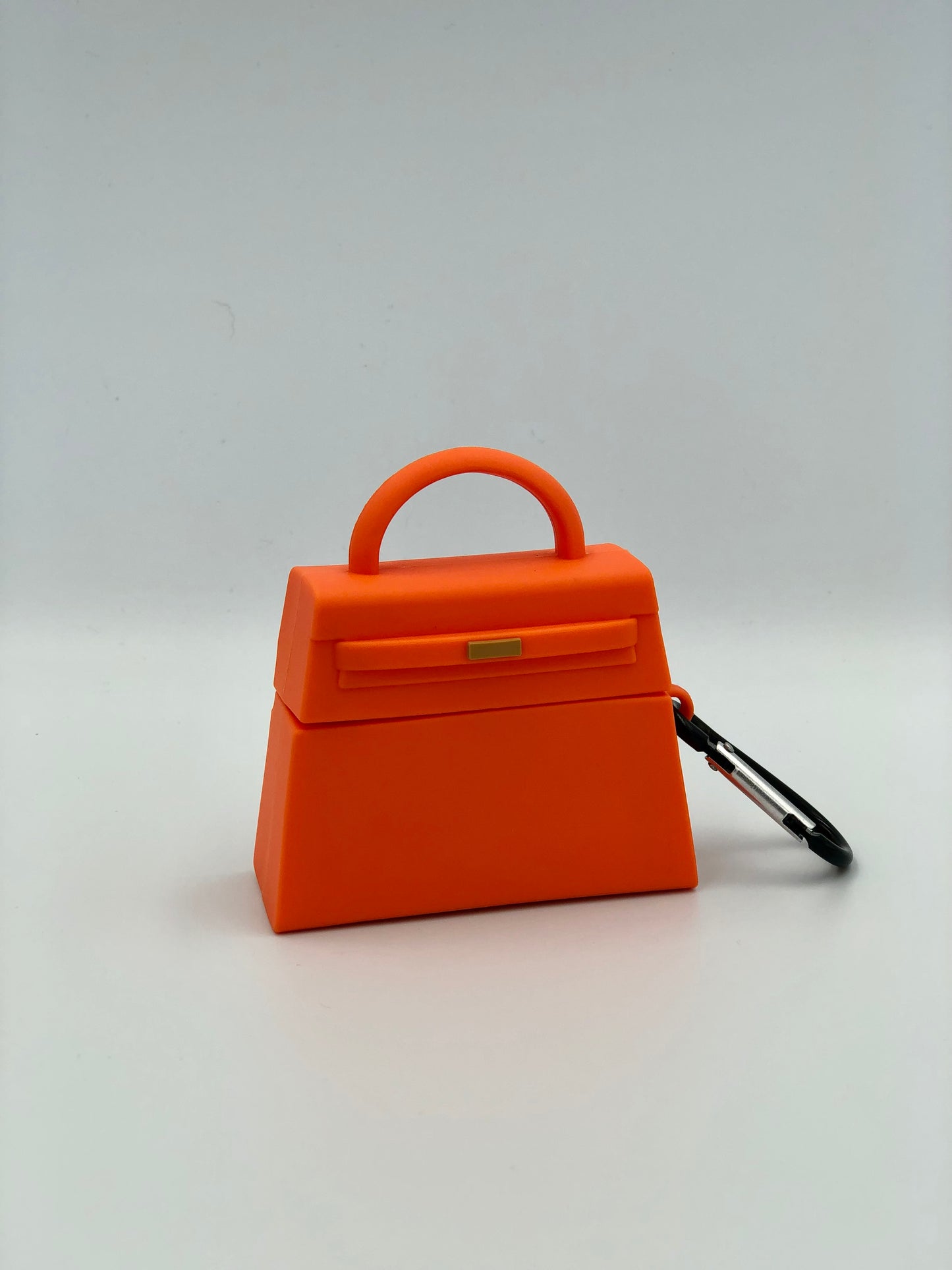 Orange Silicone Handbag Airpod Case - Keychain view. Apple AirPods and Apple Airpod case are for reference only and are not included.