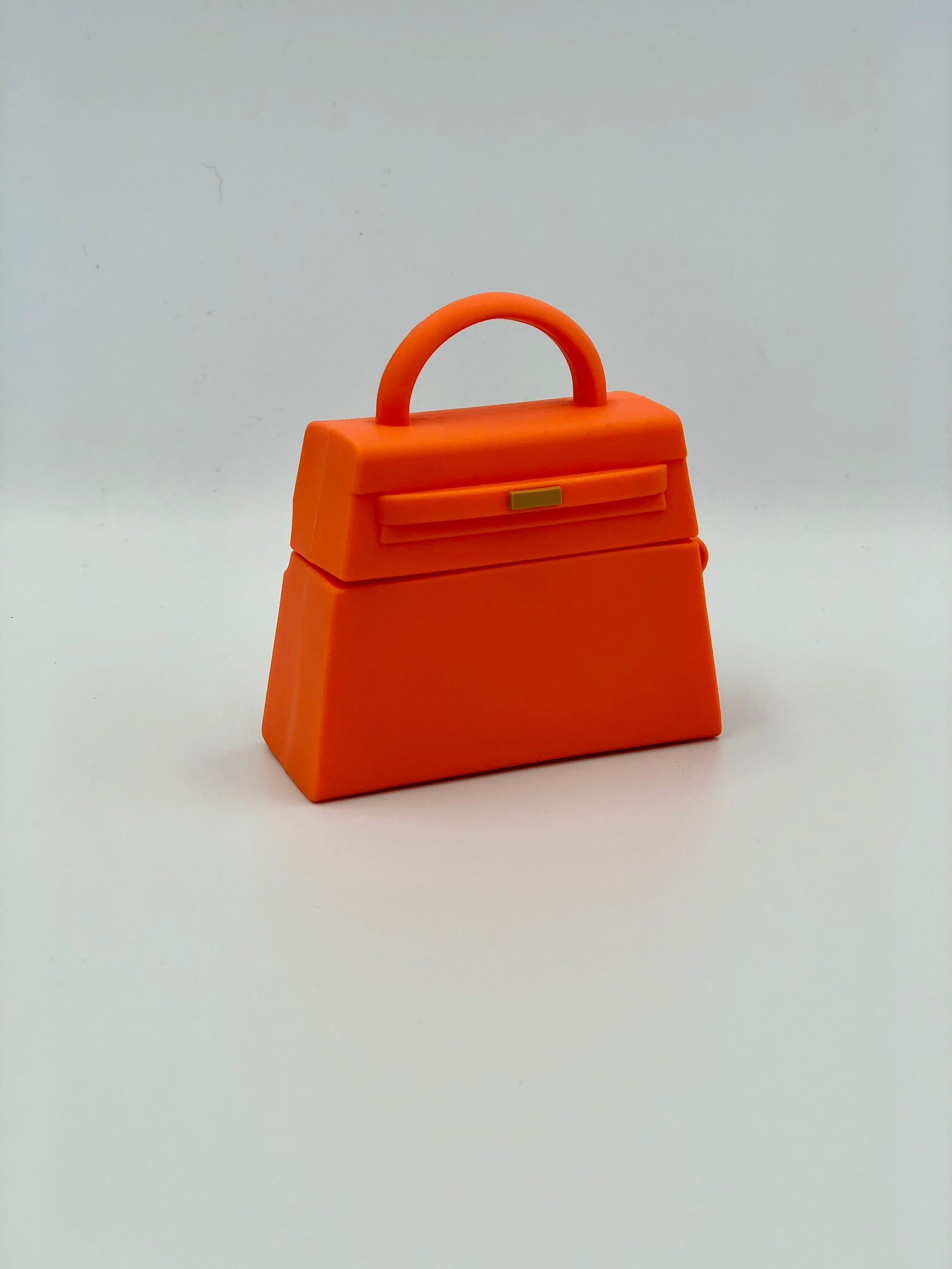 Orange Silicone Handbag Airpod Case - Front view. Apple AirPods and Apple Airpod case are for reference only and are not included.