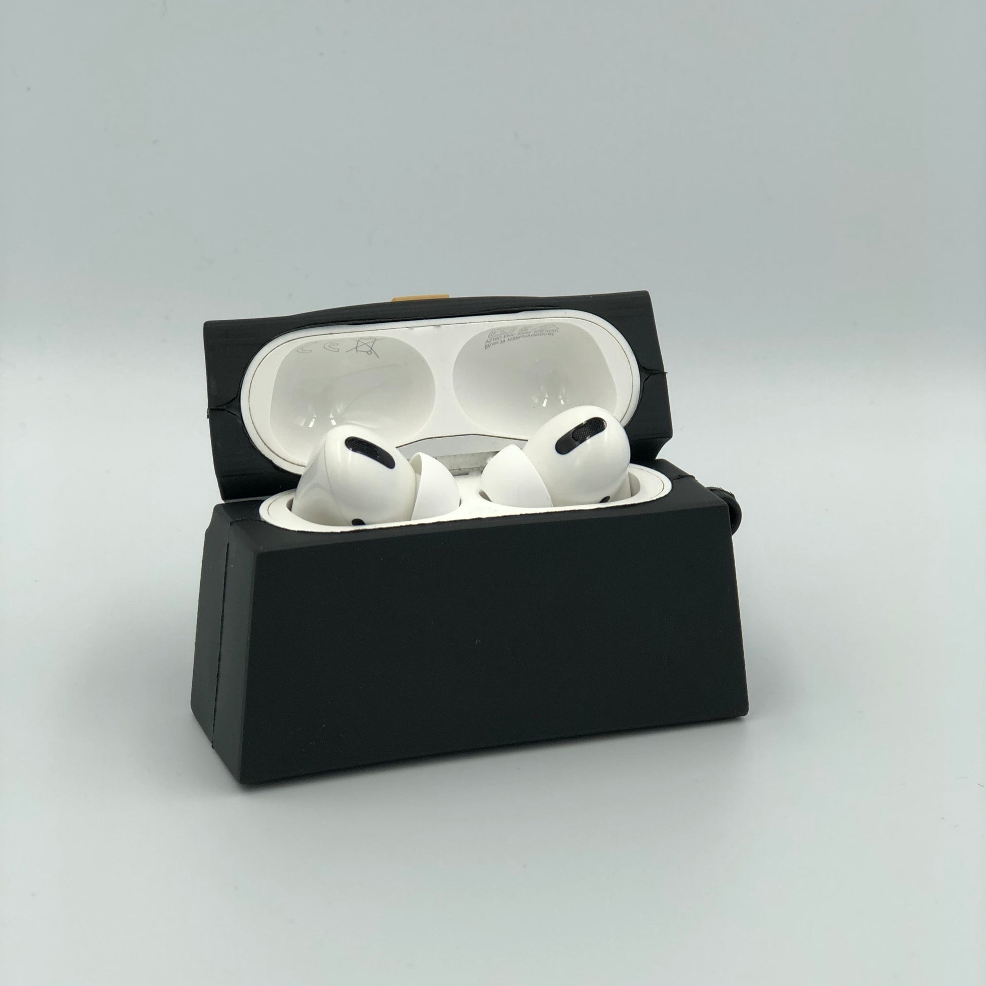 Black Silicone Handbag Airpod case - open view.  Apple AirPods and Apple Airpod case are for reference only and are not included.