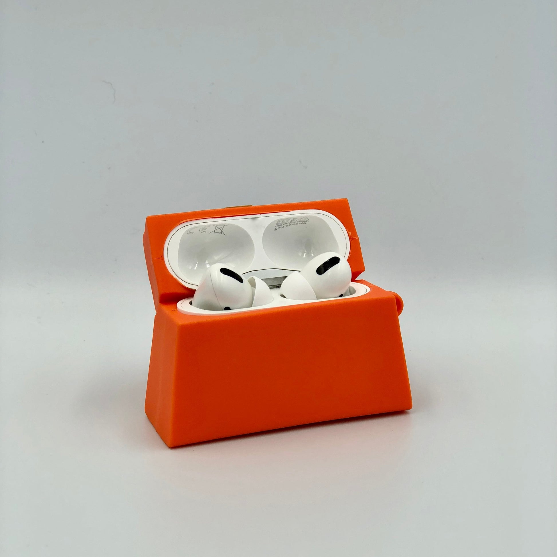 Orange Silicone Handbag Airpod Case - Open view. Apple AirPods and Apple Airpod case are for reference only and are not included.