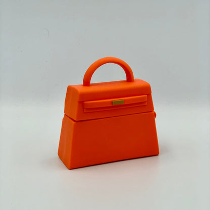 Orange Silicone Handbag Airpod Case - Front view. Apple AirPods and Apple Airpod case are for reference only and are not included.