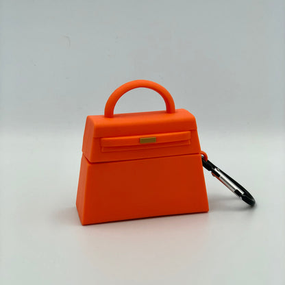 Orange Silicone Handbag Airpod Case - Keychain view. Apple AirPods and Apple Airpod case are for reference only and are not included.