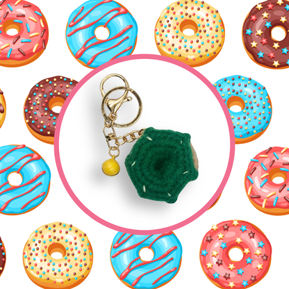 Green donut-shaped crochet handbag charm on a white background with donut pattern